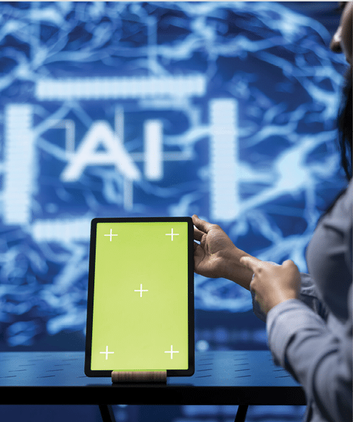 Startup coworkers brainstorming ways to use AI on chroma key tablet to improve data driven decisions. Technicians using mockup device to improve artificial intelligence tech