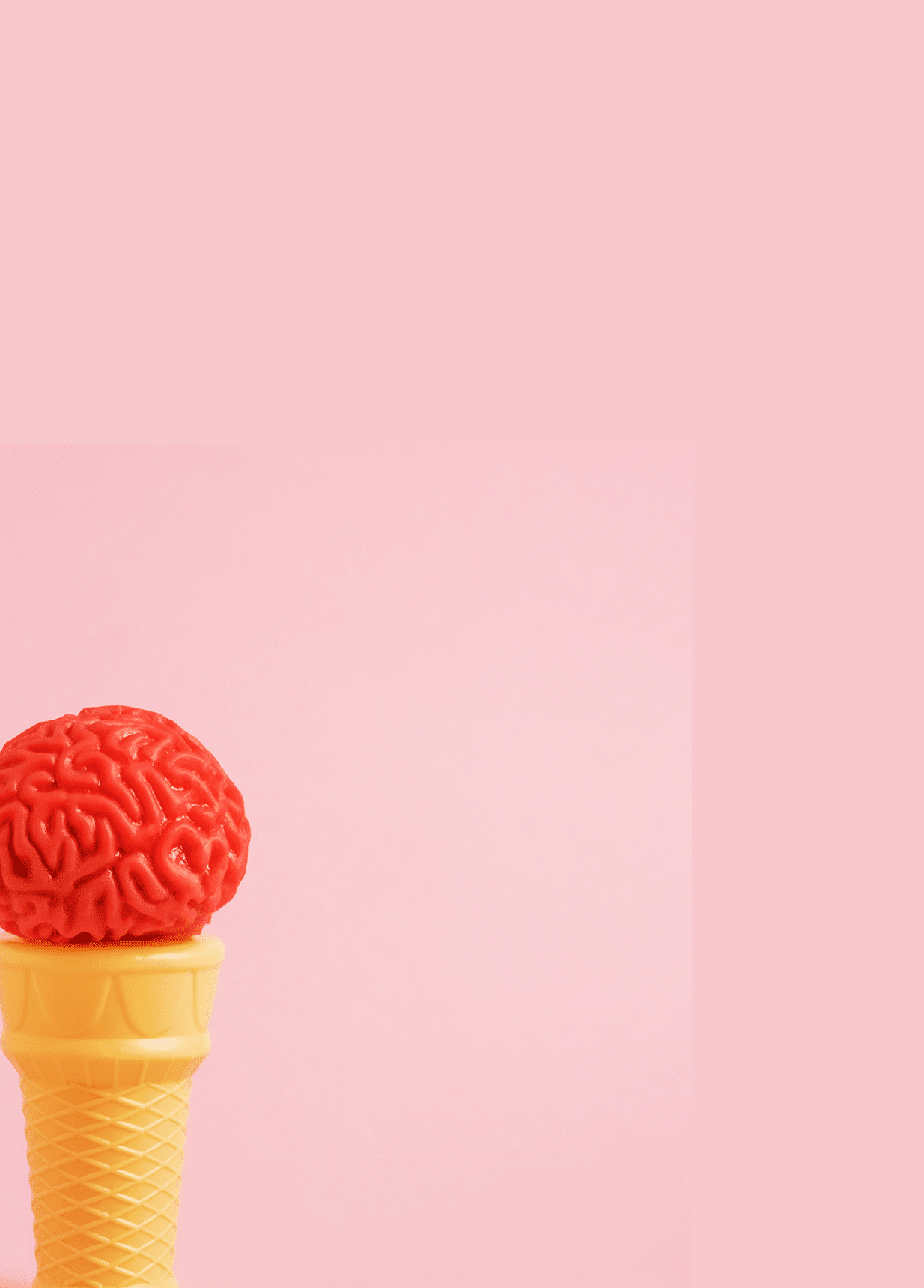 Ice cream in shape of human brain on waffle cone, pink background. Creative funny postcard idea.