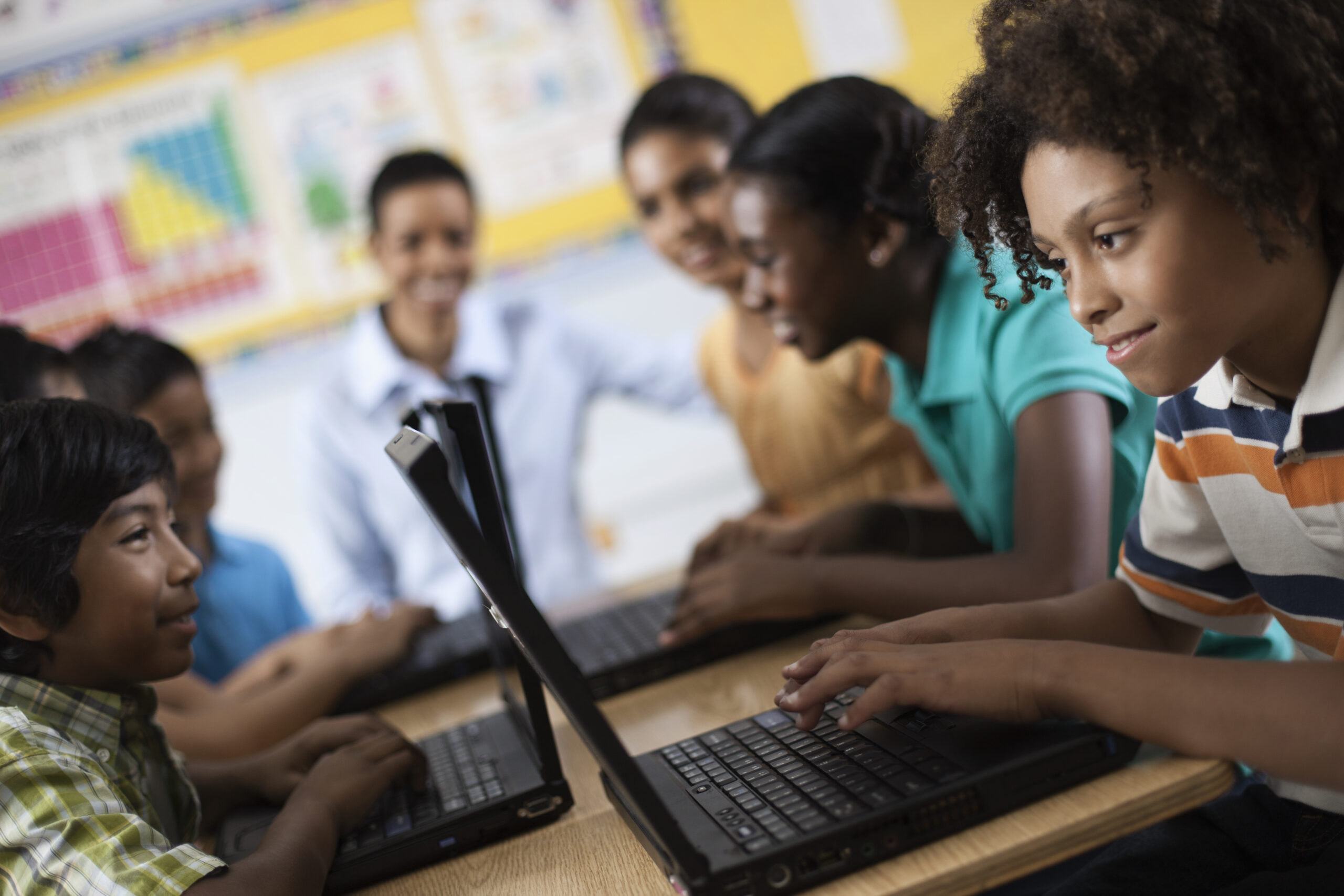 School,USA,A group of students using laptops in a lesson.